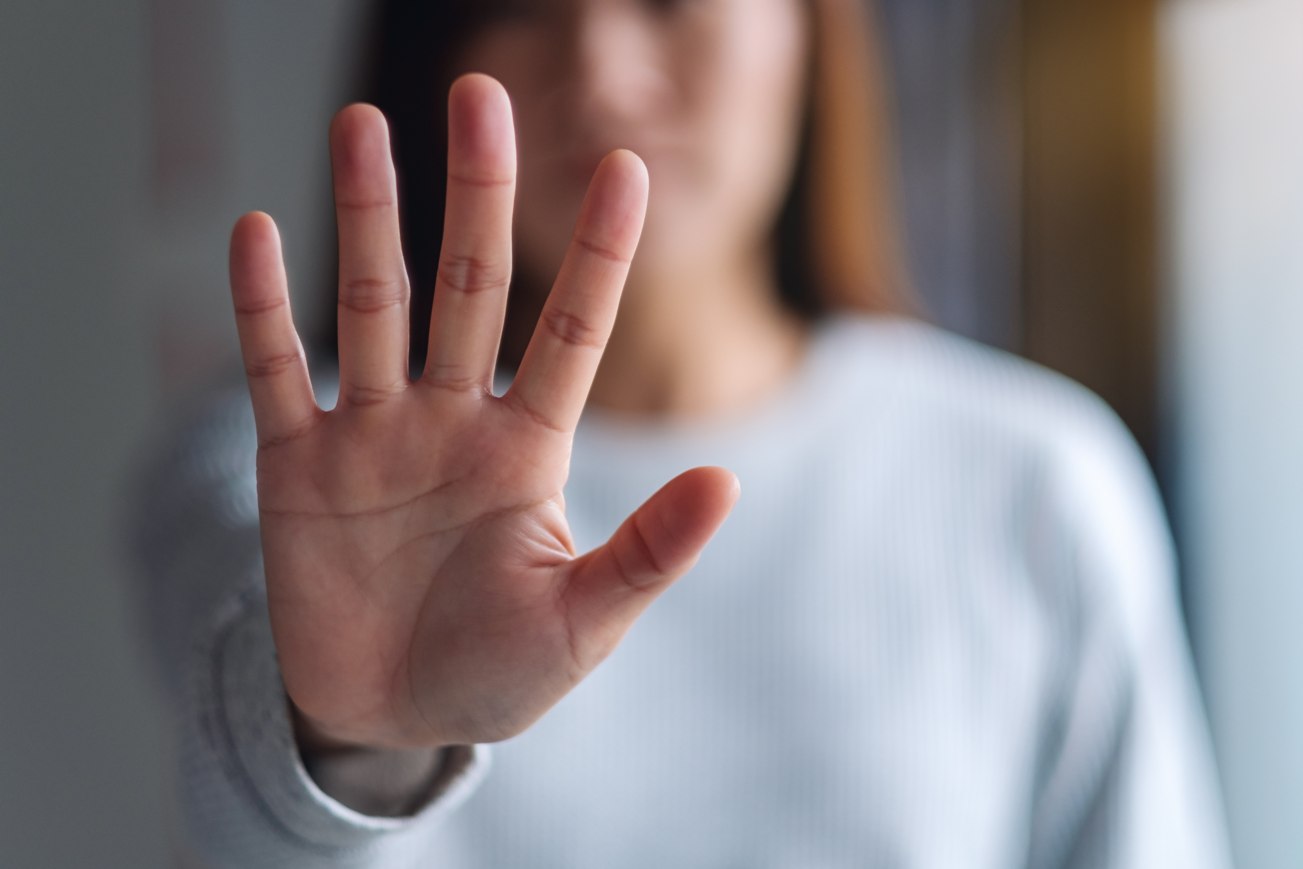 Hand showing a stop sign