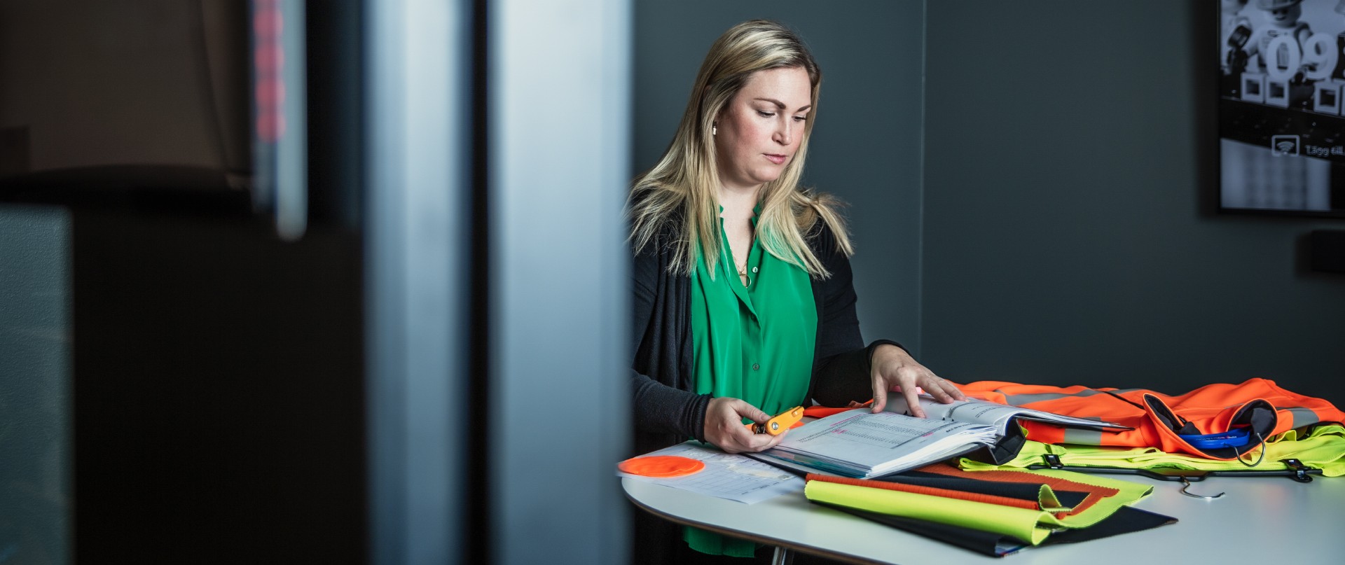 Employee testing workwear at a table