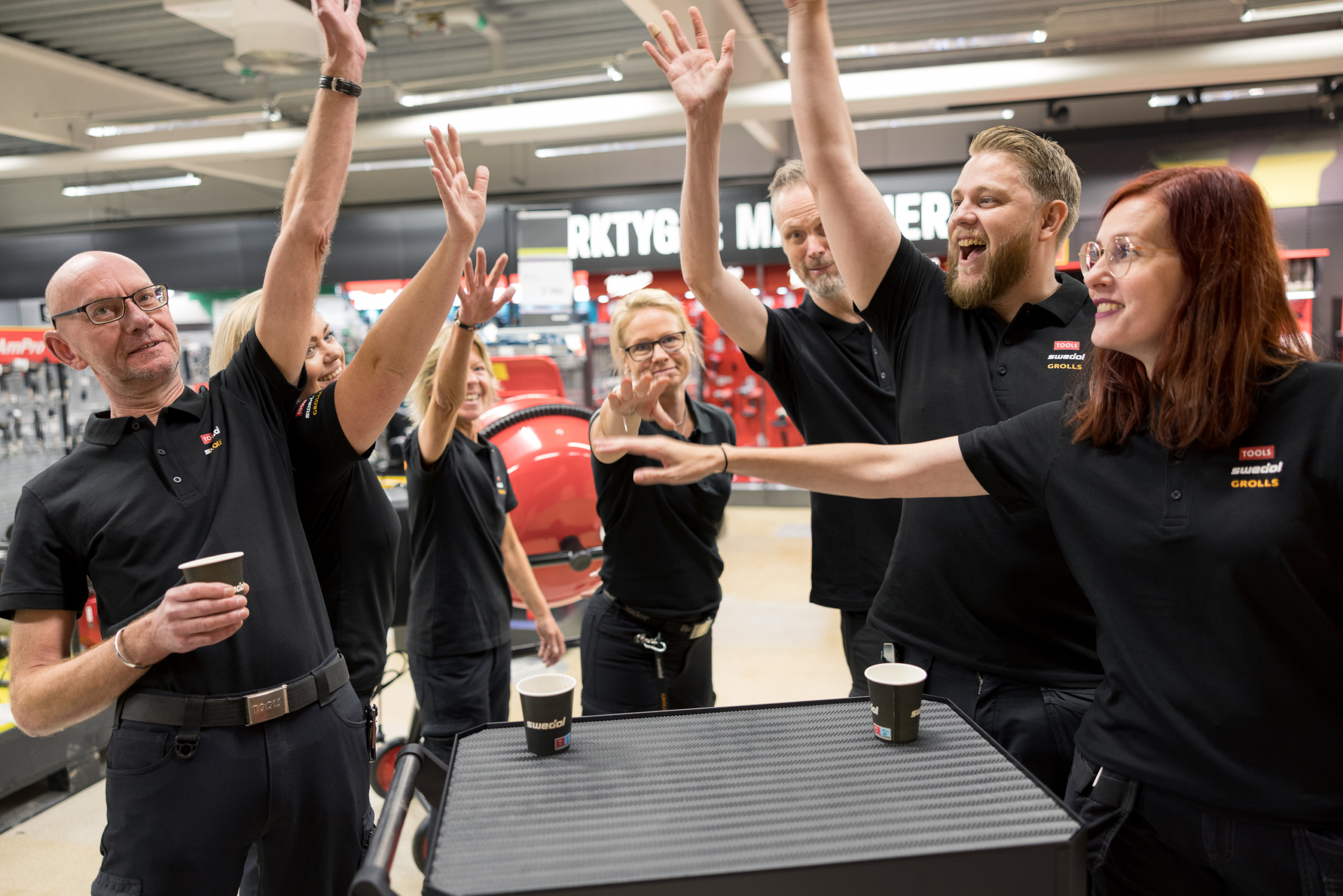 Happy employees cheering together