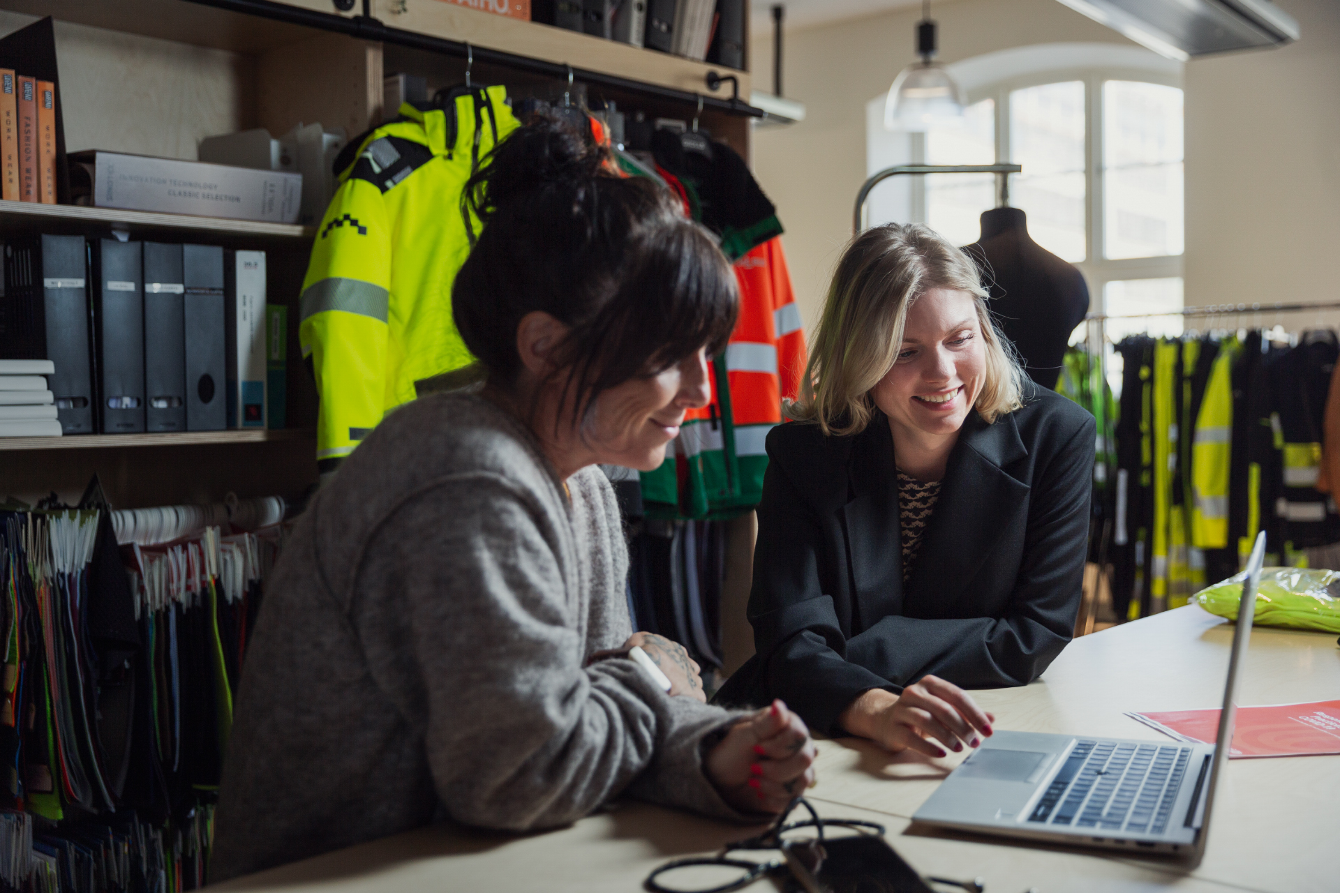 Employees working together at a desk
